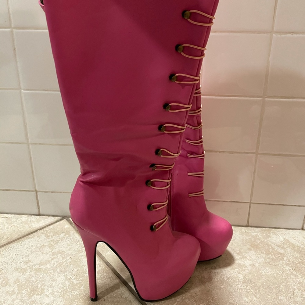 Pink knee high boots
